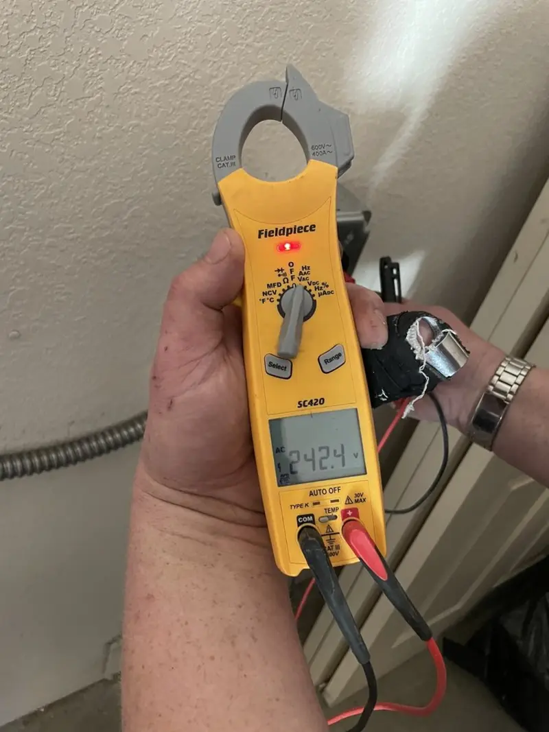 Voltage testing with clamp meter during Electrical Installation Services in Coronado